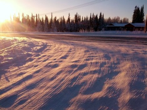 our street covered in snow and ice (the great part is that it fills all the pot holes!)